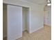 Bedroom closet with sliding doors and tile flooring at 404 12Th Sw St, Ruskin, FL 33570
