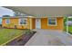 Charming single-story home with a well-maintained lawn and a covered carport at 404 12Th Sw St, Ruskin, FL 33570