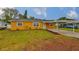 Charming single-story home with a well-maintained lawn and a covered carport at 404 12Th Sw St, Ruskin, FL 33570