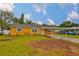 Charming single-story home with a well-maintained lawn and a covered carport at 404 12Th Sw St, Ruskin, FL 33570