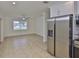 Open-concept space featuring a large living area and stainless steel appliances in the adjacent kitchen at 404 12Th Sw St, Ruskin, FL 33570
