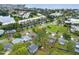 Aerial view showing proximity to a pond and nearby apartment complex in a residential area at 4600 Chancellor Ne St, St Petersburg, FL 33703