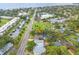 Scenic aerial view of a neighborhood with mature trees and a glimpse of the ocean at 4600 Chancellor Ne St, St Petersburg, FL 33703