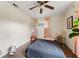 Relaxing bedroom features a ceiling fan, windows with curtains and wood flooring at 4600 Chancellor Ne St, St Petersburg, FL 33703