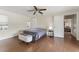Comfortable bedroom with wood-look floors and neutral tones, offering a relaxing atmosphere at 4600 Chancellor Ne St, St Petersburg, FL 33703