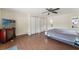 Spacious bedroom with dark wood-look flooring, and ample storage in the closets at 4600 Chancellor Ne St, St Petersburg, FL 33703