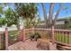 Inviting outdoor deck and garden area with charming pink railing, and lush greenery at 4600 Chancellor Ne St, St Petersburg, FL 33703