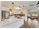 Bright and airy kitchen with a center island, stainless steel appliances, and an open view to the living area at 4600 Chancellor Ne St, St Petersburg, FL 33703