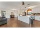 Open kitchen featuring a center island, stainless steel appliances, white cabinets and view of living area at 4600 Chancellor Ne St, St Petersburg, FL 33703
