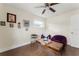 Charming living room with a ceiling fan, wood flooring, cozy seating, and natural light at 4600 Chancellor Ne St, St Petersburg, FL 33703