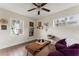 Bright living room with wood flooring, natural light, cozy seating, and decorative wall art at 4600 Chancellor Ne St, St Petersburg, FL 33703