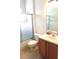 Bathroom with a shower-tub combo, toilet, single sink, and wood-look flooring at 4633 Mapletree Loop, Wesley Chapel, FL 33544