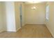 Dining room featuring hard surface flooring, hanging chandelier, and view of kitchen area at 4633 Mapletree Loop, Wesley Chapel, FL 33544