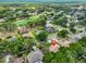 Aerial view of a suburban neighborhood with tree-lined streets, showcasing a single Gathering home at 4942 Willow Ridge Ter, Valrico, FL 33596