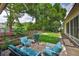 Lush backyard featuring a grill, lounge chairs and a well-manicured garden area at 4942 Willow Ridge Ter, Valrico, FL 33596