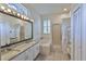 Bright bathroom with dual sinks, bathtub, and walk-in shower at 4942 Willow Ridge Ter, Valrico, FL 33596