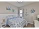 Cozy bedroom with nautical decor and a comfortable bed at 4942 Willow Ridge Ter, Valrico, FL 33596