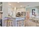 Open kitchen featuring a breakfast bar, stainless steel appliances, and easy access to the dining area at 4942 Willow Ridge Ter, Valrico, FL 33596