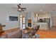 Inviting living room with a fireplace, hardwood floors, and an open layout to the kitchen at 4942 Willow Ridge Ter, Valrico, FL 33596