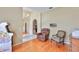 Spacious living area with hardwood floors, providing a glimpse into adjacent rooms at 4942 Willow Ridge Ter, Valrico, FL 33596