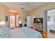 Spacious main bedroom featuring wood floors and an ensuite bathroom at 4942 Willow Ridge Ter, Valrico, FL 33596