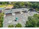 An aerial view of well-maintained tennis courts, perfect for sports enthusiasts, surrounded by trees and landscaping at 4942 Willow Ridge Ter, Valrico, FL 33596