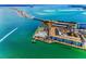 Overhead view showcasing a waterfront condo community with a pier, pool, and access to the bay at 5 Gateshead Dr # 308, Dunedin, FL 34698