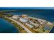 Aerial view showcases the community's beautiful waterfront location with nearby beaches and picturesque views of the bay at 5 Gateshead Dr # 308, Dunedin, FL 34698