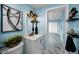 Stylish bathroom features a modern vanity, decorative lighting, and elegant black and white wall art at 5 Gateshead Dr # 308, Dunedin, FL 34698