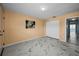 Cozy bedroom with marble floors, closet, and a door leading to a bathroom with ocean views at 5 Gateshead Dr # 308, Dunedin, FL 34698