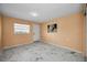 Bright, spacious bedroom featuring marble floors, a window with a view, and neutral-toned walls at 5 Gateshead Dr # 308, Dunedin, FL 34698