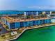 Waterfront condo building with manicured lawns and stunning waterfront views, perfect for relaxation and enjoying the coastal lifestyle at 5 Gateshead Dr # 308, Dunedin, FL 34698