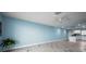 Bright, open-concept living area featuring elegant marble floors and a seamless flow into the kitchen at 5 Gateshead Dr # 308, Dunedin, FL 34698