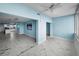 Airy living area with gorgeous marble floors leading into an open kitchen, flooded with natural light at 5 Gateshead Dr # 308, Dunedin, FL 34698
