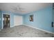 Cozy bedroom featuring marble floors, neutral walls, and generous closet space at 5 Gateshead Dr # 308, Dunedin, FL 34698