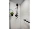 Modern shower with sleek fixtures, glass shelving, and white tiled walls at 5 Gateshead Dr # 308, Dunedin, FL 34698