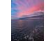 Stunning waterfront view of the ocean under a pink and blue sky with interesting clouds at 5 Gateshead Dr # 308, Dunedin, FL 34698
