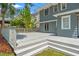 Large, gray wood deck on the back of the home offers ample space for entertaining at 516 14Th Ne Ave, St Petersburg, FL 33701