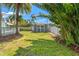 Backyard featuring tropical foliage and stand-alone storage building at 516 14Th Ne Ave, St Petersburg, FL 33701