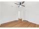 Bedroom featuring hardwood floors, a ceiling fan, and two entrances at 516 14Th Ne Ave, St Petersburg, FL 33701
