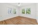 Bright bedroom with hardwood floors and large windows providing great natural light at 516 14Th Ne Ave, St Petersburg, FL 33701