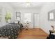 Inviting bedroom with light hardwood floors and contemporary decor at 516 14Th Ne Ave, St Petersburg, FL 33701