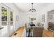 Charming dining space with backyard access and a view of the living room and kitchen at 516 14Th Ne Ave, St Petersburg, FL 33701