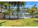 Charming two-story home with a large backyard, deck, and lush tropical landscaping at 516 14Th Ne Ave, St Petersburg, FL 33701