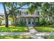 Charming two-story home with mature trees, manicured lawn, and inviting front porch at 516 14Th Ne Ave, St Petersburg, FL 33701