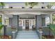 Inviting front porch with black door, cozy seating, and stylish decor at 516 14Th Ne Ave, St Petersburg, FL 33701