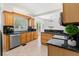 Bright kitchen features granite countertops, stainless steel appliances, and wood cabinets at 516 14Th Ne Ave, St Petersburg, FL 33701
