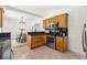 Well-equipped kitchen featuring stainless appliances, granite countertops, and wooden cabinets at 516 14Th Ne Ave, St Petersburg, FL 33701