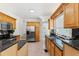 Bright kitchen with stainless steel appliances, granite counters, and tile flooring at 516 14Th Ne Ave, St Petersburg, FL 33701