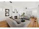 Bright living room features a brick fireplace, hardwood floors, and neutral decor for a cozy atmosphere at 516 14Th Ne Ave, St Petersburg, FL 33701